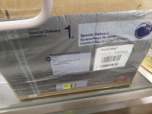 Lois Bullion seller pack attached to a secure box with a pre-paid Royal Mail label